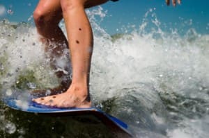 feet on a surfboard