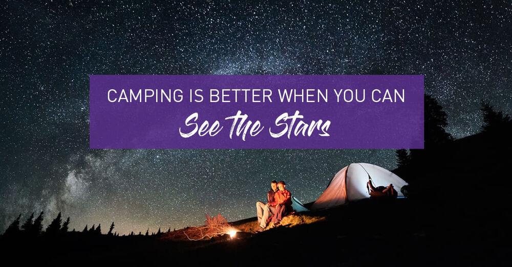 couple sitting by a campfiler outside their tent under the starry sky - Camping Is Better When You Can See The Stars Graphic