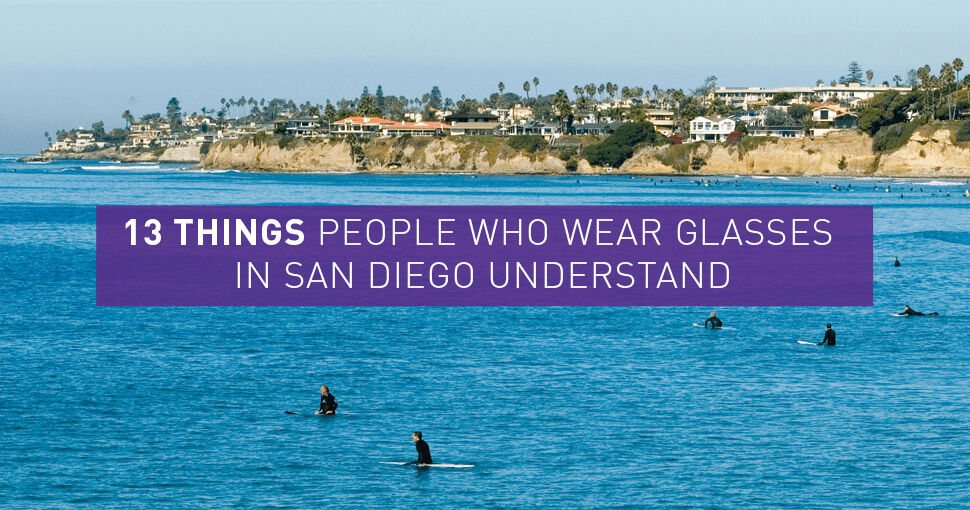 Surfers sitting on surfboards in the water - 13 Things People Who Wear Glasses in San Diego Will Understand