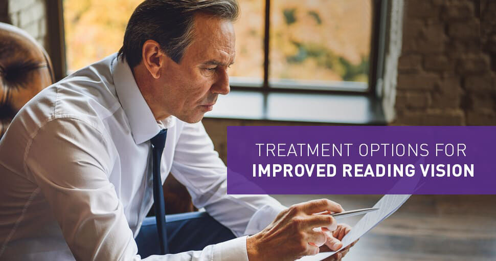 Man looking studying a document - Treatment Options For Improved Reading Vision Graphic