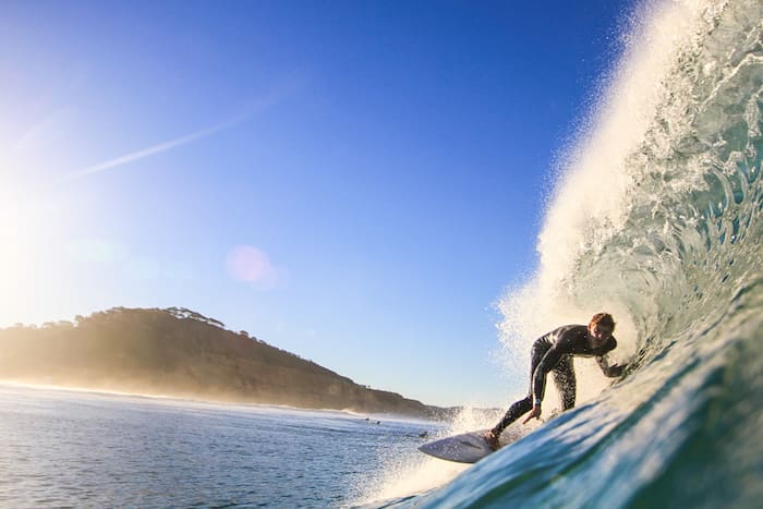 Alex surfing a barrel