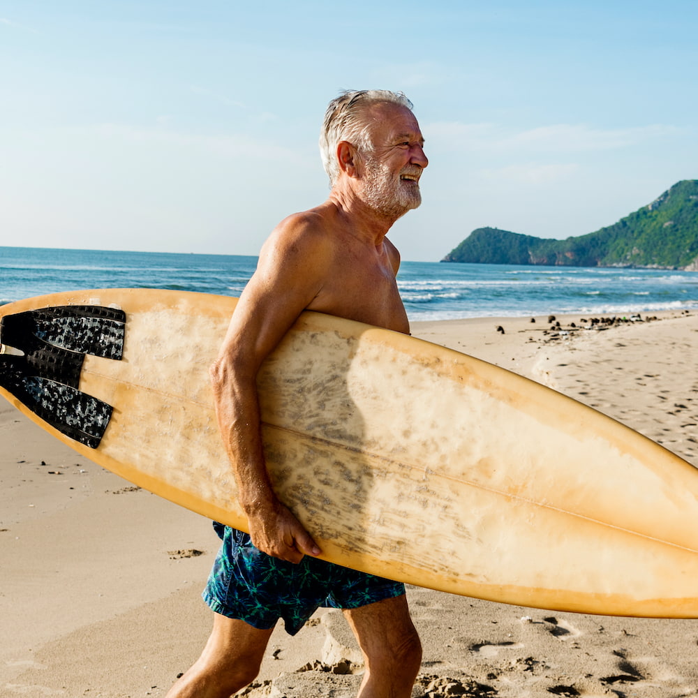 senior man surfing
