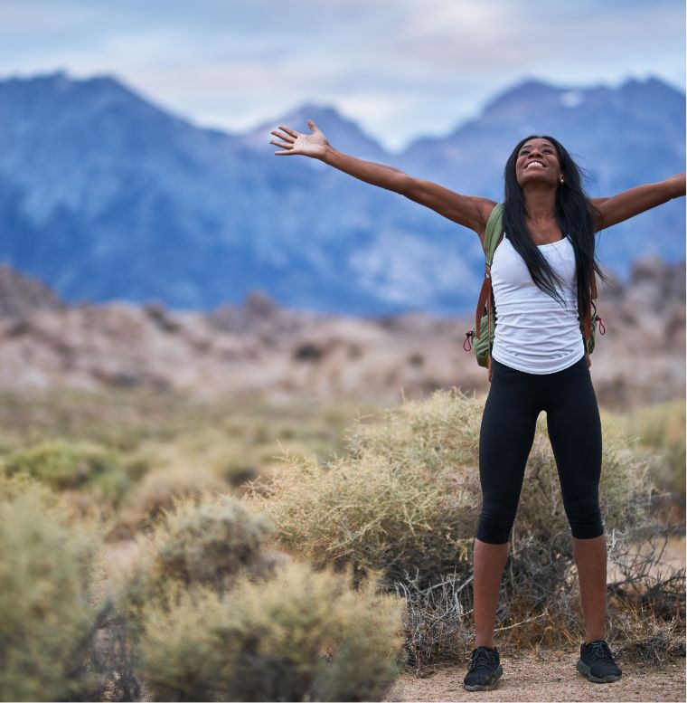 woman hiking feeling free