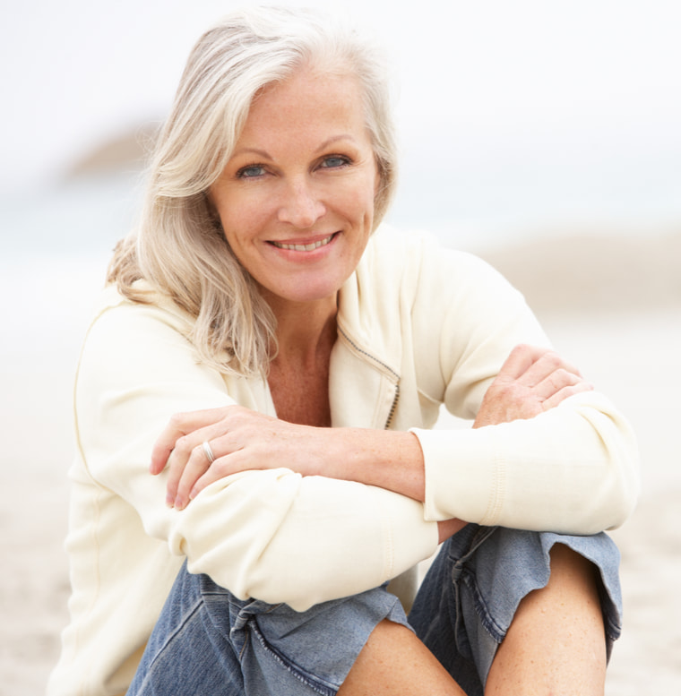 senior woman at the beach relaxing