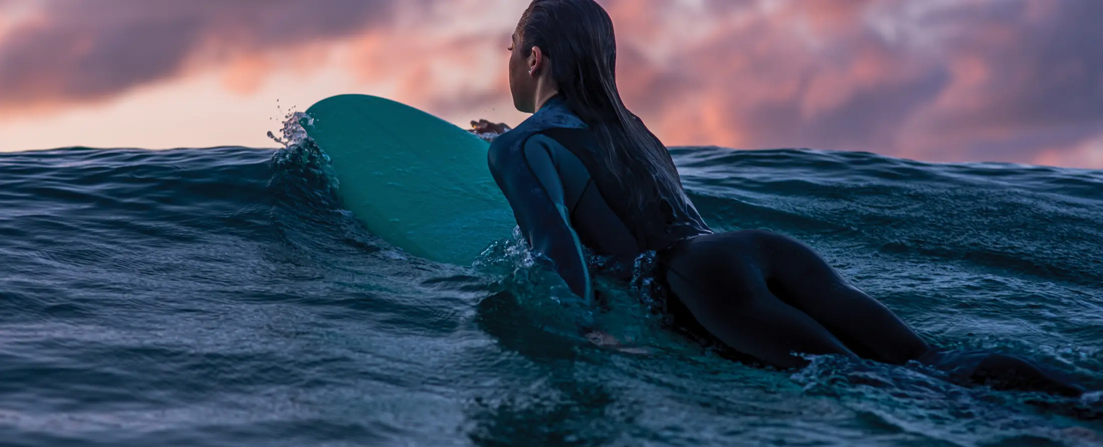 female surfer during the sunset