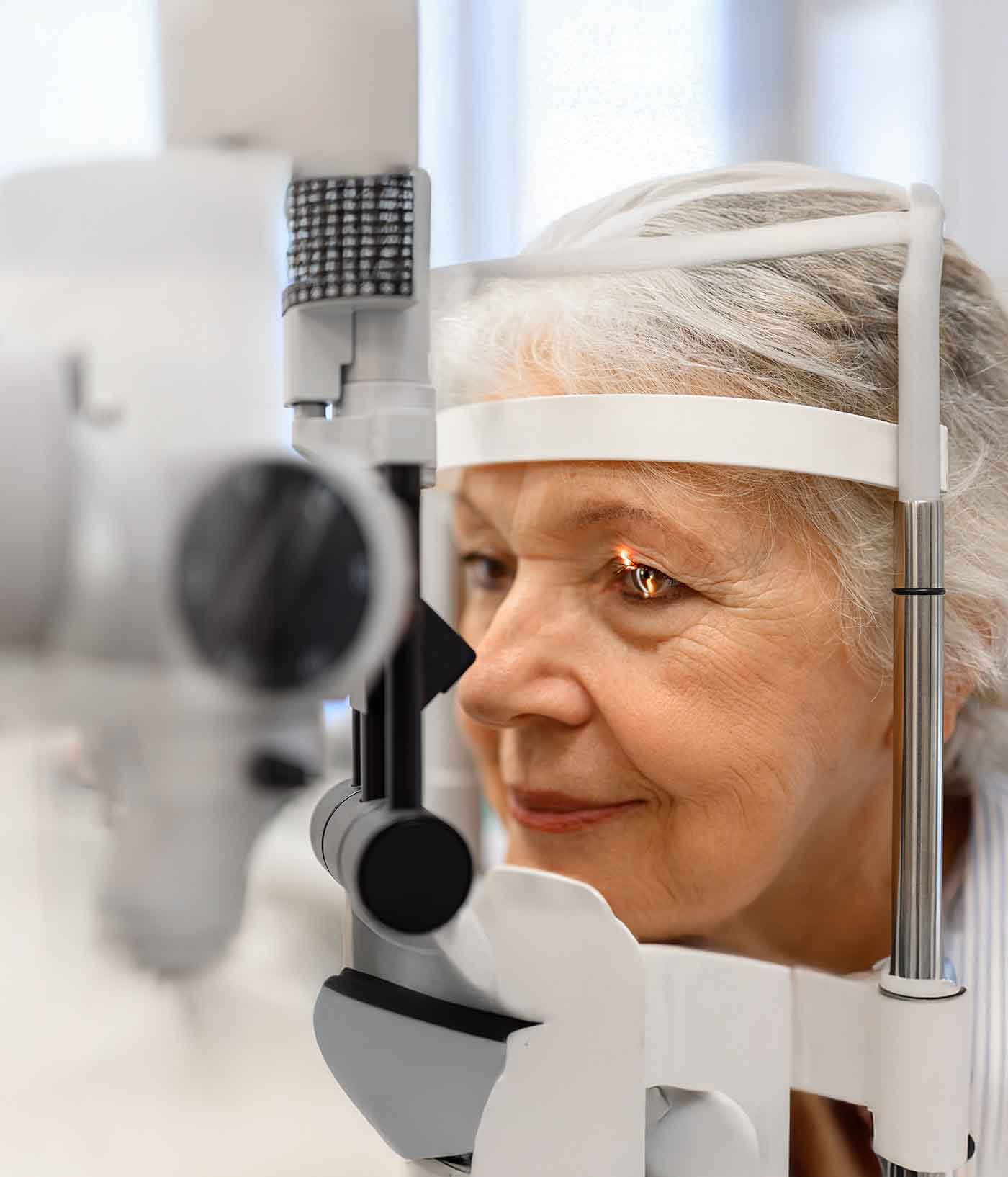 older woman with cataracts getting laser at doctor
